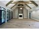 Open living room with wood beams, fireplace, and hardwood floors at 210 Carl Sanders Dr, Acworth, GA 30101