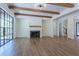 Living room with fireplace, hardwood floors, and access to backyard at 210 Carl Sanders Dr, Acworth, GA 30101