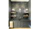 Custom wet bar with marble backsplash and floating shelves at 210 Carl Sanders Dr, Acworth, GA 30101
