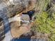 Overhead view of the property showcasing the landscaping, driveway, and surrounding trees at 3536 Evans Ridge Trl, Atlanta, GA 30340