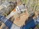 Aerial view of home showing the driveway and landscaping, sitting on a corner lot at 3536 Evans Ridge Trl, Atlanta, GA 30340