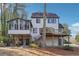 Expansive backyard featuring a multi-level deck, sunroom and patio area, perfect for outdoor entertaining at 3536 Evans Ridge Trl, Atlanta, GA 30340