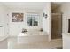 Bathroom features a soaking tub, separate shower, and large window at 3536 Evans Ridge Trl, Atlanta, GA 30340