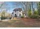 Charming two-story home featuring a well-maintained lawn and mature trees, providing curb appeal and a sense of tranquility at 3536 Evans Ridge Trl, Atlanta, GA 30340