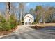 Two-story home with a two-car garage and a private deck surrounded by mature trees at 3536 Evans Ridge Trl, Atlanta, GA 30340