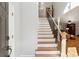 Bright foyer showcasing new hardwood stairs with iron railing at 3536 Evans Ridge Trl, Atlanta, GA 30340