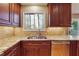 Well-appointed kitchen featuring granite countertops, stainless steel appliances, and wooden cabinets at 3536 Evans Ridge Trl, Atlanta, GA 30340