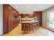 Spacious kitchen featuring wood floors, an island with seating, and stainless steel appliances at 3536 Evans Ridge Trl, Atlanta, GA 30340