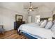 Vaulted ceiling main bedroom featuring a ceiling fan, wood floors, and ample closet space at 3536 Evans Ridge Trl, Atlanta, GA 30340