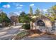 Gated community entrance with brick signage and landscaping at 1680 Perserverence Hill Nw Cir # 23, Kennesaw, GA 30152