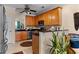 Kitchen with wood cabinets, stainless steel appliances, and granite countertops at 1680 Perserverence Hill Nw Cir # 23, Kennesaw, GA 30152