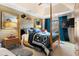 Elegant main bedroom with a four-poster bed and ensuite bathroom at 1680 Perserverence Hill Nw Cir # 23, Kennesaw, GA 30152