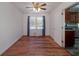 Bright dining room with hardwood floors and a ceiling fan at 313 Fayette Villa Ct, Fayetteville, GA 30214