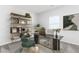 Bright home office with built-in shelving and modern desk at 317 Lavender Ln, Holly Springs, GA 30115