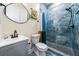 Modern bathroom with blue tile shower and gray vanity at 140 Wesley Pl, Fayetteville, GA 30214