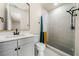 Modern bathroom with gray vanity and walk-in shower at 140 Wesley Pl, Fayetteville, GA 30214