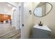 Modern powder room with gray vanity and black matte fixtures at 140 Wesley Pl, Fayetteville, GA 30214