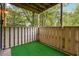 Outdoor balcony enclosed by a white fence and trees at 2824 Vinings Central Se Dr # 146, Atlanta, GA 30339