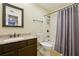 Traditional bathroom featuring a granite-topped vanity and a shower-tub combination with tile surround at 2824 Vinings Central Se Dr # 146, Atlanta, GA 30339