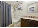 Traditional bathroom with granite vanity and a shower-tub combination with a classic shower curtain at 2824 Vinings Central Se Dr # 146, Atlanta, GA 30339