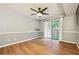 Bedroom with wood-look floors, ceiling fan, and a sliding glass door to a small outdoor patio at 2824 Vinings Central Se Dr # 146, Atlanta, GA 30339