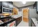 Modern kitchen with stainless steel appliances, granite countertops, and sleek cabinetry at 2824 Vinings Central Se Dr # 146, Atlanta, GA 30339