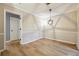 Room with neutral wall paint and trim, wood-look floors, and a modern light fixture at 2824 Vinings Central Se Dr # 146, Atlanta, GA 30339
