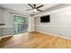 Bright living room with sliding door to a patio and wood-look flooring at 2824 Vinings Central Se Dr # 146, Atlanta, GA 30339