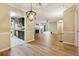 An open-concept layout featuring hardwood floors, a living room, dining area, and modern kitchen at 2824 Vinings Central Se Dr # 146, Atlanta, GA 30339
