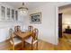 Cozy dining room with a chandelier, wood floors, and a view into the adjacent room at 300 Johnson Ferry Ne Rd # B610, Atlanta, GA 30328