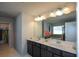 Double vanity bathroom with a large mirror and a soaking tub at 309 Bowfin Trl, Mcdonough, GA 30253