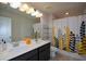 Modern bathroom with double vanity and shower/tub combo at 309 Bowfin Trl, Mcdonough, GA 30253