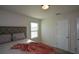 Spacious bedroom featuring a plush bed and large window at 309 Bowfin Trl, Mcdonough, GA 30253