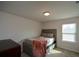 Well-lit bedroom with a comfy bed and ample space at 309 Bowfin Trl, Mcdonough, GA 30253