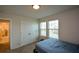 Bright bedroom with double doors and en-suite bathroom at 309 Bowfin Trl, Mcdonough, GA 30253