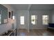 Light and airy entryway with wood-look floors and a view of the front door at 309 Bowfin Trl, Mcdonough, GA 30253