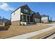 Two-story home with a side entry garage and landscaped yard at 309 Bowfin Trl, Mcdonough, GA 30253