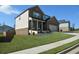 Two-story home with a side entry garage and landscaped yard at 309 Bowfin Trl, Mcdonough, GA 30253
