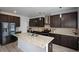 Large kitchen island with granite countertops and double sink at 309 Bowfin Trl, Mcdonough, GA 30253