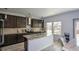 Modern kitchen with granite countertops and stainless steel appliances at 309 Bowfin Trl, Mcdonough, GA 30253