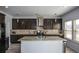 Modern kitchen with stainless steel appliances and granite countertops at 309 Bowfin Trl, Mcdonough, GA 30253