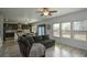 Living room with kitchen and backyard access at 309 Bowfin Trl, Mcdonough, GA 30253