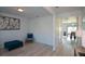 Living room with hardwood floors and a view of the dining area at 309 Bowfin Trl, Mcdonough, GA 30253