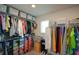 Large walk-in closet with ample shelving and hanging space at 309 Bowfin Trl, Mcdonough, GA 30253