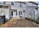 Backyard with patio, air conditioner, and exterior of home with white siding and windows at 2878 Norfair Loop, Lithonia, GA 30038