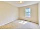 This small bedroom has neutral walls, carpet flooring, and a window at 2878 Norfair Loop, Lithonia, GA 30038