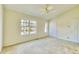 Bright bedroom featuring neutral walls, carpet flooring, and a window at 2878 Norfair Loop, Lithonia, GA 30038