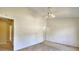 Large bedroom with neutral walls, carpet flooring, and a ceiling fan at 2878 Norfair Loop, Lithonia, GA 30038