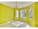 Dining room featuring a chandelier, tiled floors, and abundant natural light from the windows at 2878 Norfair Loop, Lithonia, GA 30038