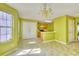 Dining room with tiled floors, natural light from windows, and an open floor plan to the kitchen at 2878 Norfair Loop, Lithonia, GA 30038